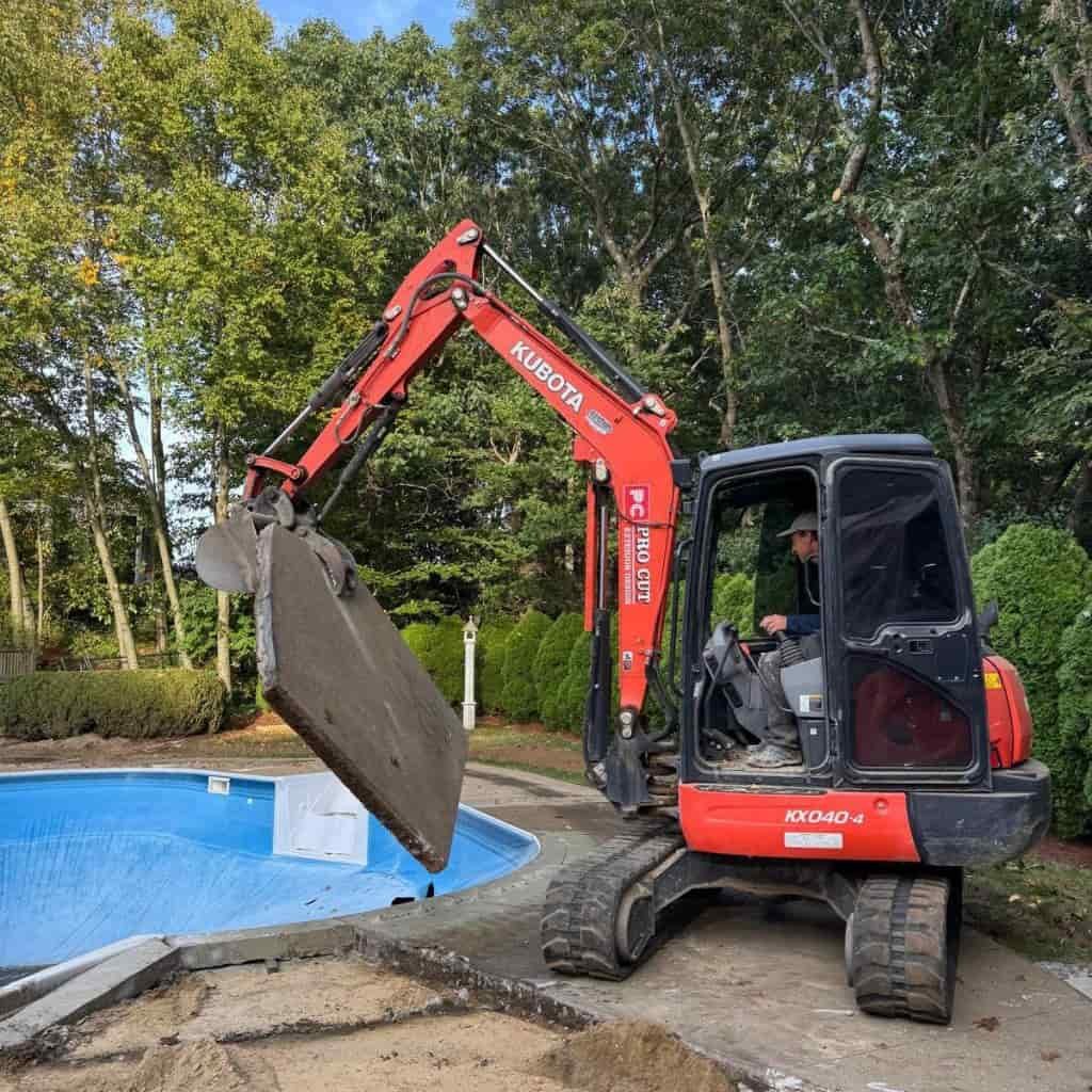 Excavator lifting concrete slab Excavator lifting concrete slab